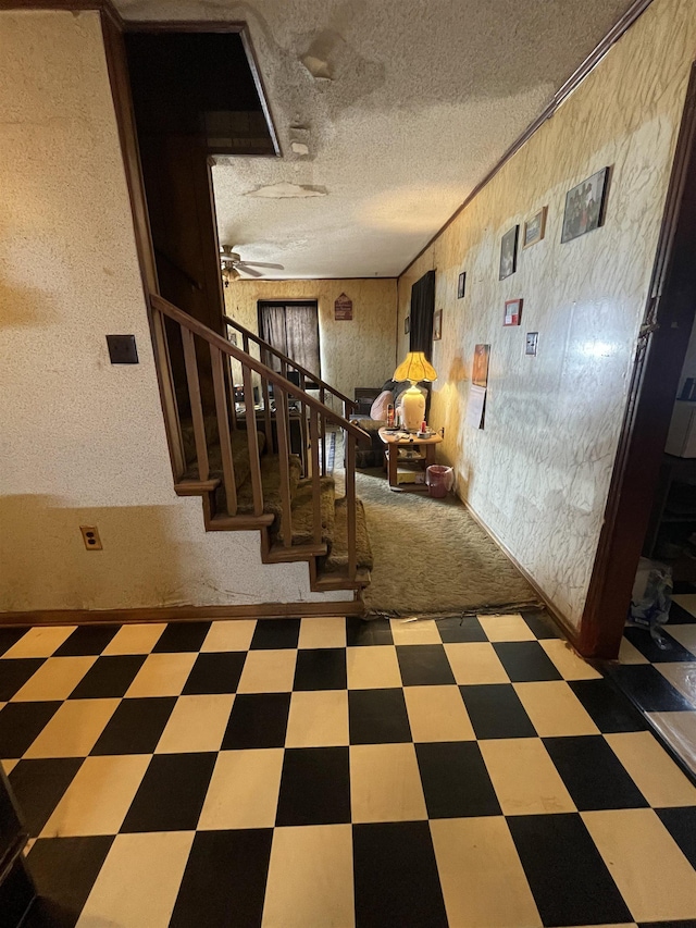 corridor featuring a textured ceiling