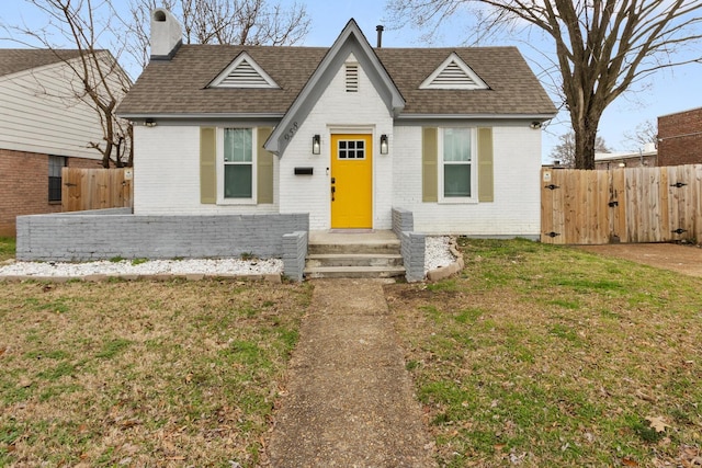 view of front of property with a front lawn