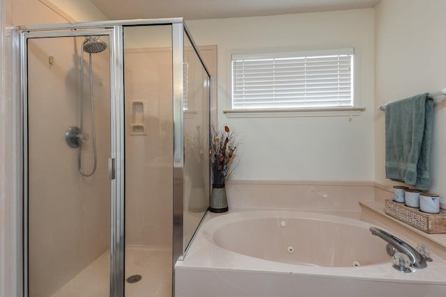 bathroom with shower with separate bathtub