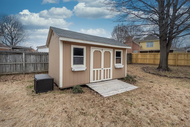 view of outdoor structure featuring a lawn