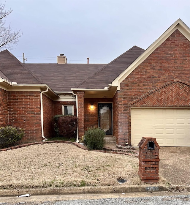 ranch-style house featuring a garage