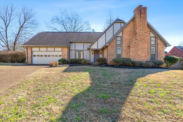 view of front of home featuring a front lawn and a garage