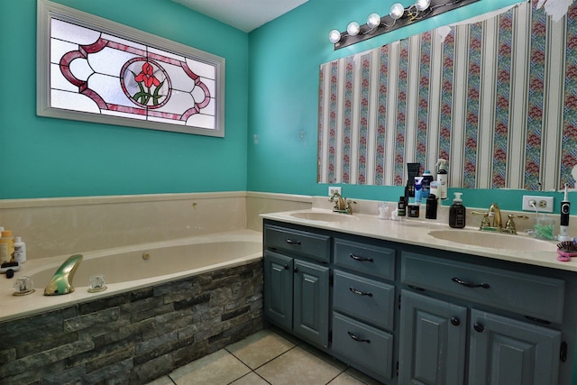 bathroom featuring tiled bath, tile patterned flooring, and vanity