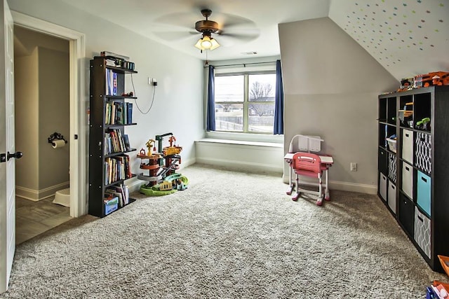 rec room featuring carpet, lofted ceiling, and ceiling fan