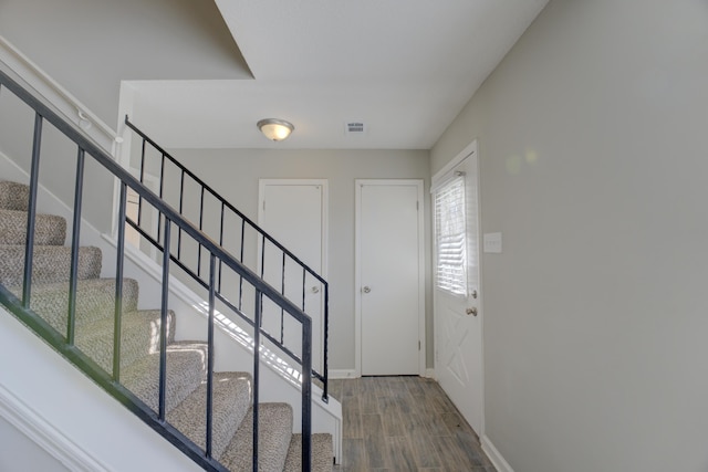 foyer entrance with wood-type flooring