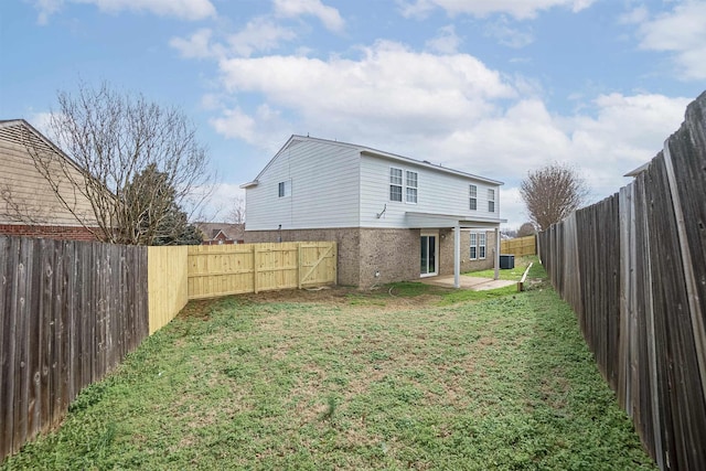 view of yard featuring a patio and a fenced backyard