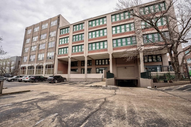 view of property with uncovered parking