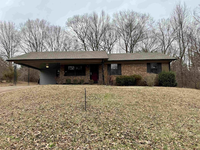 ranch-style house featuring brick siding, roof with shingles, and a front yard