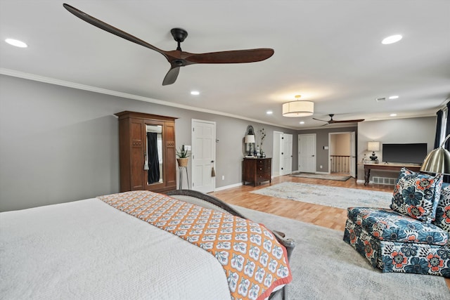 590 Shady Hollow Cv, Eads, TN 38028 - bedroom featuring visible vents, crown molding, wood finished floors, baseboards, and recessed lighting