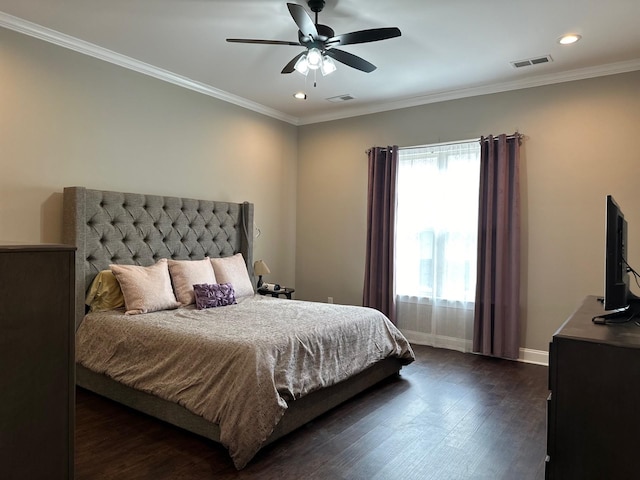 bedroom with ornamental molding, dark wood finished floors, and visible vents