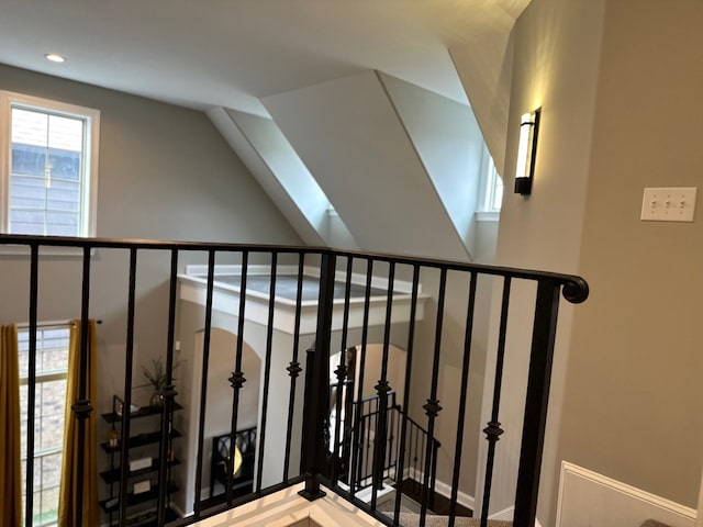 staircase with lofted ceiling