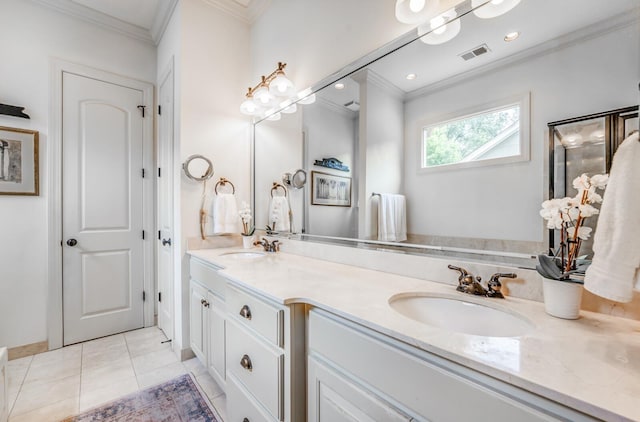 bathroom with double vanity, visible vents, a sink, and ornamental molding