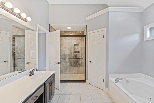 full bath featuring a tub with jets, a shower stall, vanity, and tile patterned floors