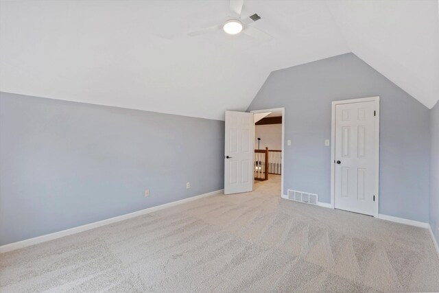 bonus room with lofted ceiling, ceiling fan, visible vents, and light colored carpet