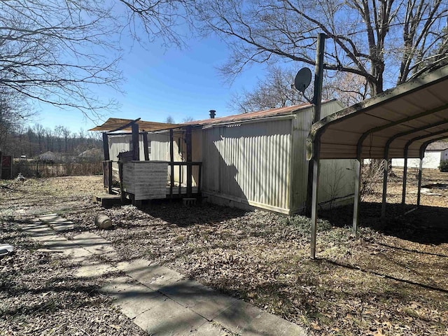 view of property exterior with a detached carport