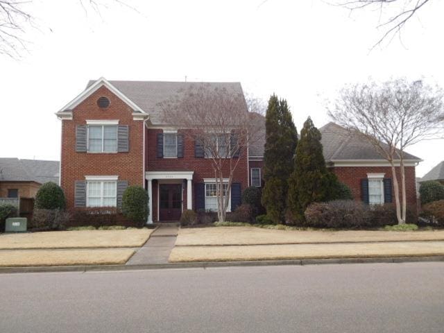 view of front of house featuring brick siding