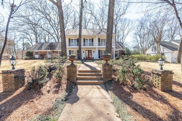 view of front of property featuring french doors and brick siding