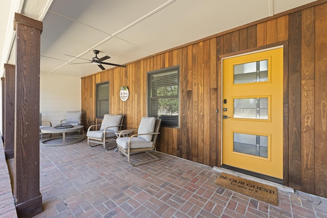 entrance to property with a ceiling fan