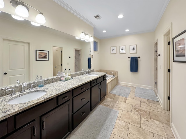 full bath with crown molding, a sink, and baseboards