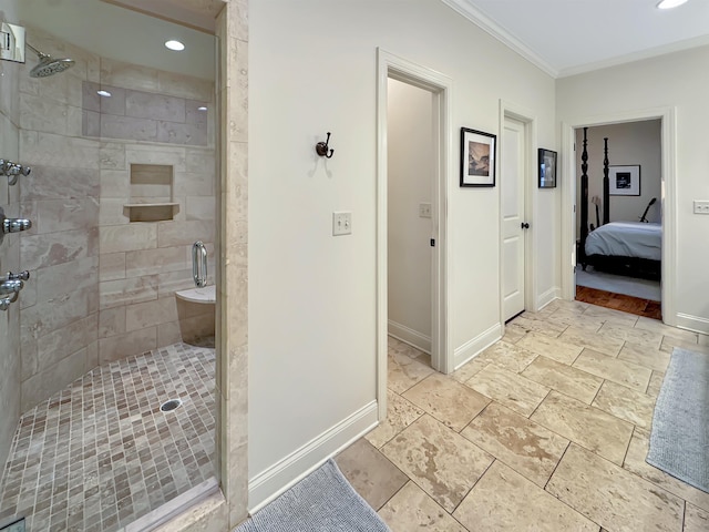 ensuite bathroom with ensuite bath, baseboards, crown molding, and a shower stall