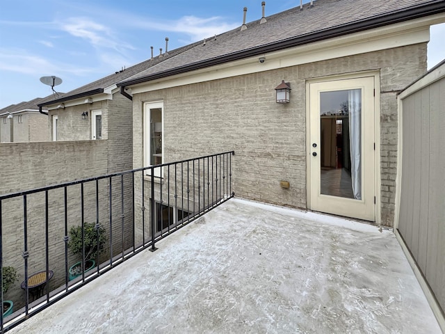 view of patio featuring a balcony