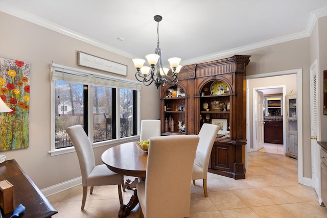 dining space featuring a chandelier, ornamental molding, light tile patterned floors, and baseboards