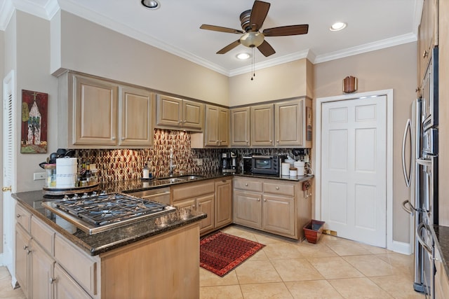 kitchen with stainless steel appliances, a sink, ornamental molding, decorative backsplash, and dark stone counters