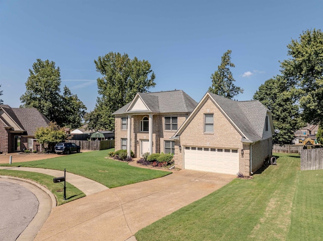 view of front facade with brick siding, concrete driveway, a front yard, fence, and a garage