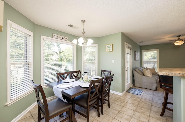 dining room with baseboards, visible vents, a textured ceiling, a chandelier, and light tile patterned flooring