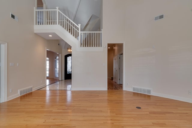 interior space featuring light wood-style floors and visible vents