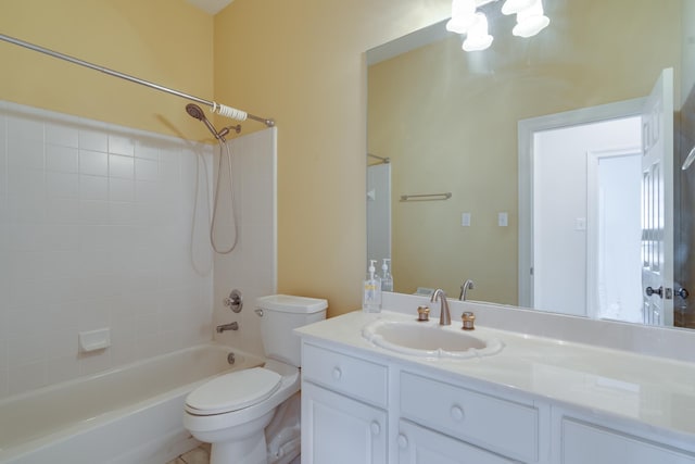 bathroom with toilet, shower / bathing tub combination, and vanity