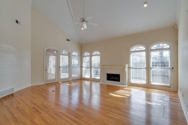 unfurnished living room featuring light wood-style floors, visible vents, and a ceiling fan