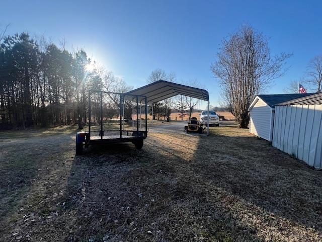 view of yard with a detached carport