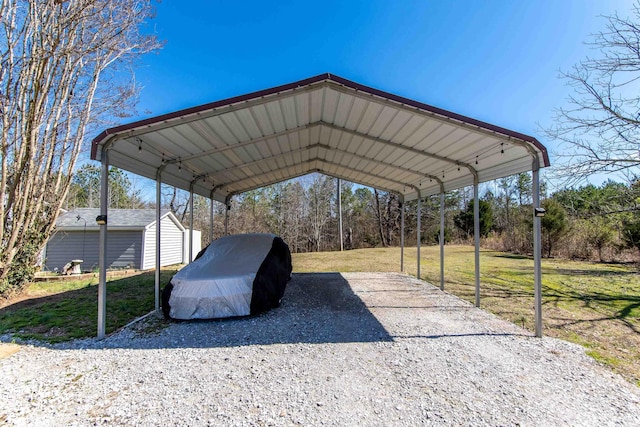 view of parking with a carport and driveway