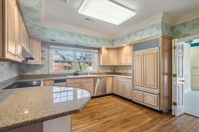 962 E Riverwalk Dr E, Memphis, TN 38120 - kitchen with a sink, visible vents, stainless steel dishwasher, light brown cabinetry, and wallpapered walls