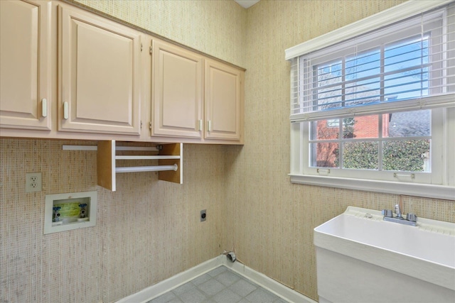 962 E Riverwalk Dr E, Memphis, TN 38120 - laundry room featuring hookup for a washing machine, a sink, baseboards, cabinet space, and electric dryer hookup