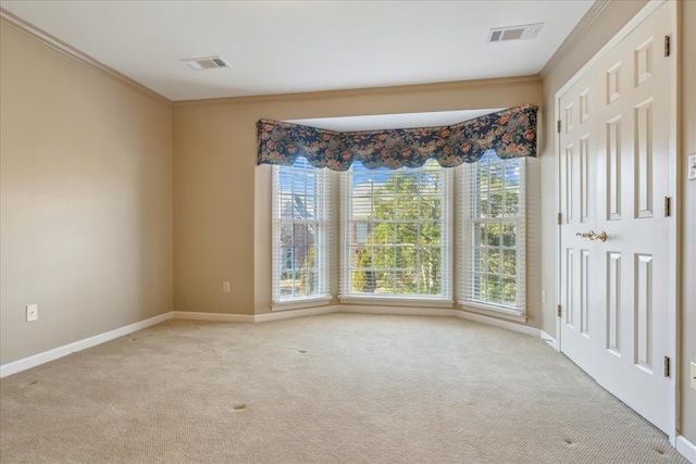 962 E Riverwalk Dr E, Memphis, TN 38120 - spare room featuring visible vents, light colored carpet, and ornamental molding