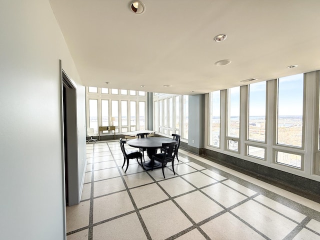 sunroom / solarium with plenty of natural light and visible vents