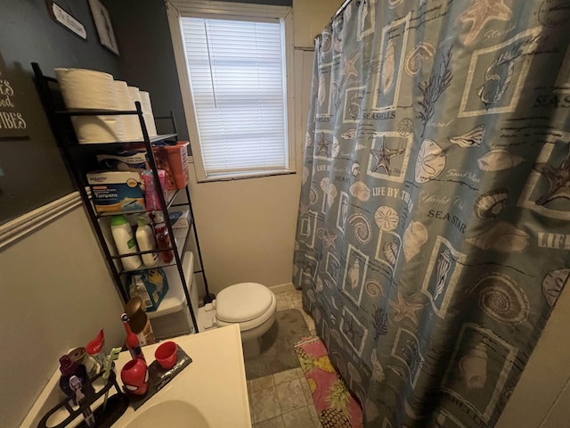 full bath featuring toilet, a shower with curtain, and tile patterned floors