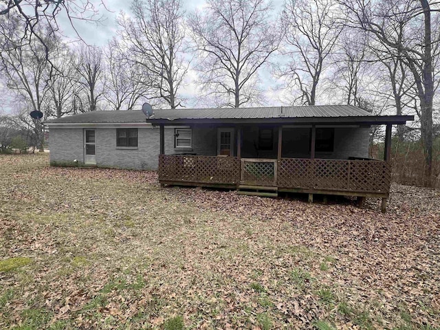 back of house with brick siding