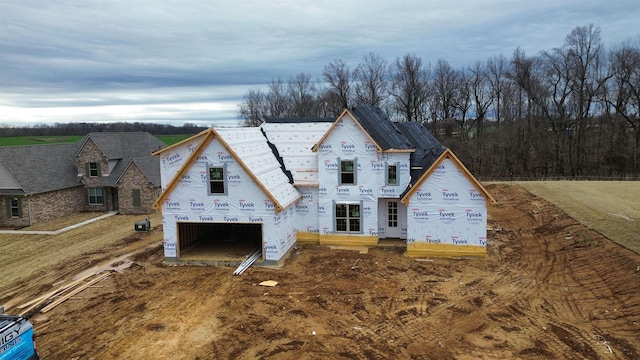 unfinished property featuring a garage