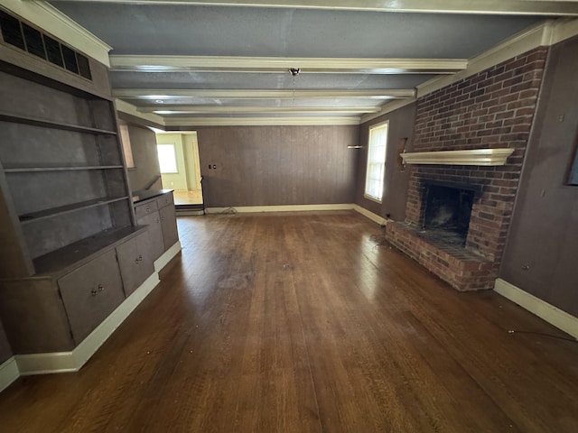 unfurnished living room with beam ceiling, a fireplace, visible vents, dark wood-type flooring, and baseboards