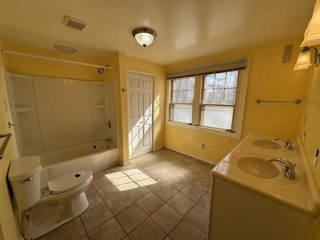 bathroom with toilet, visible vents, shower / washtub combination, and a sink