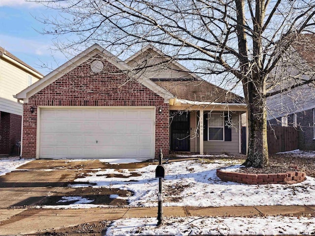 ranch-style home with a garage, brick siding, and driveway