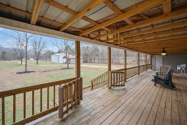 wooden terrace with a lawn