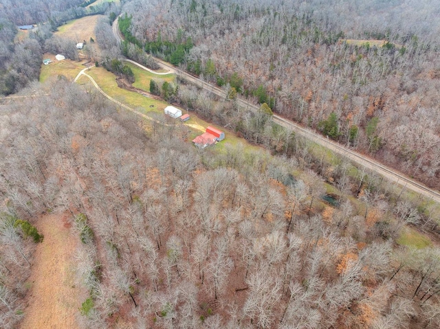 birds eye view of property with a forest view