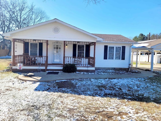 view of front of home with covered porch, a carport, crawl space, and roof with shingles