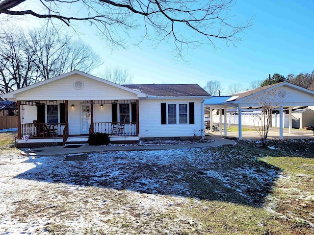 view of front of house with covered porch, crawl space, and fence