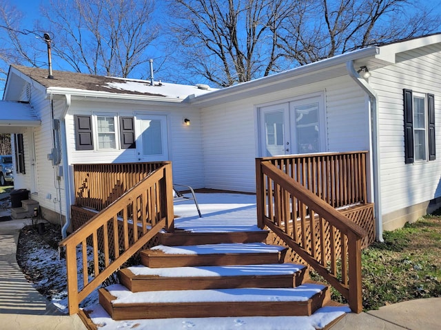 entrance to property with a wooden deck