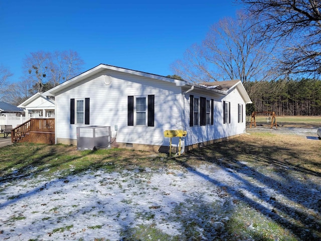 view of property exterior featuring crawl space and cooling unit